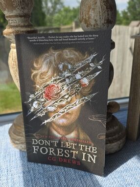 Don't Let The Forest In by C.G. Drews - Dark Floral Horror Paperback